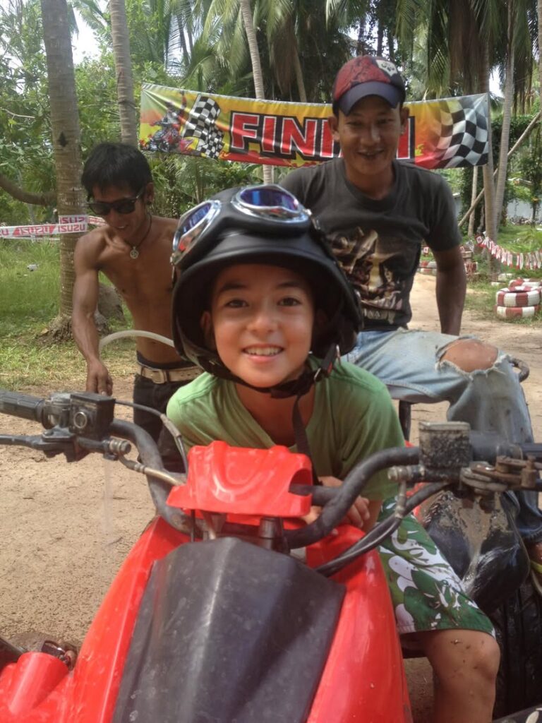 Thrills and Smiles: A Young Rider’s Triumph on the Tropical ATV Track
