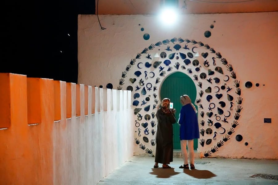 Friday evening in Asilah. A soft breeze drifts through the…